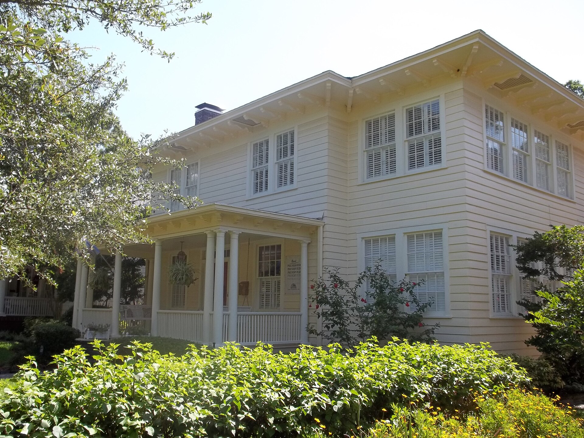 White two-story clapboard house with porch in Hyde Park, Tampa